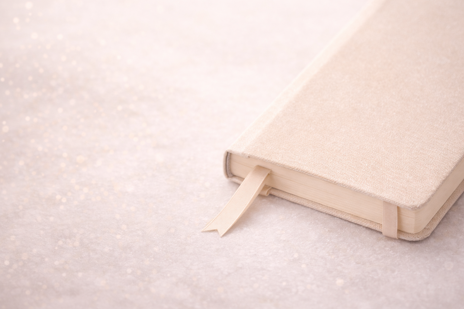 Ribboned journal symbolizing reflection and keepsakes